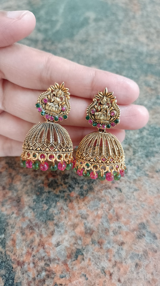 "Antique Gold Jhumka Earrings with Goddess Lakshmi Design & Ruby Emerald Beads"